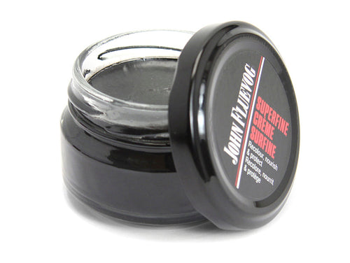 black - A jar of Fluevog leather conditioner in the colour black