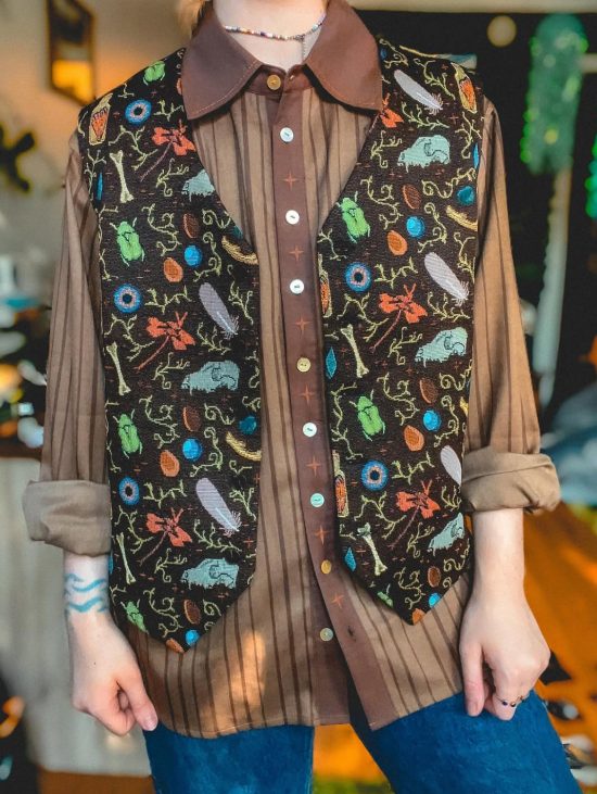 A vest with various nature and animal-inspired elements.